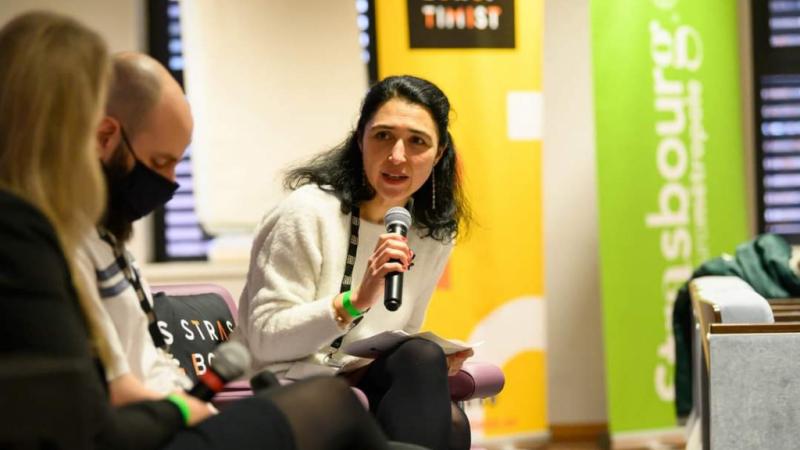 Photo of woman holding microphone